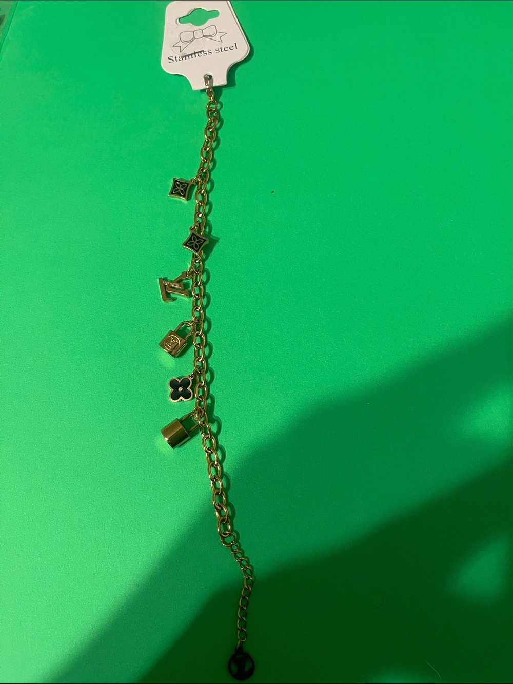 Source Unknown Gold Charm Bracelet with Floral and Lock Accents